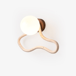 Driftform Travertine Wall Sconce with Opal Glass Globe