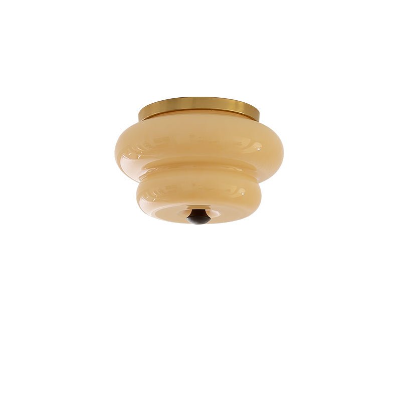 Curvaceous Flush Mount Ceiling Light with Gold Accents and Glass Shade
