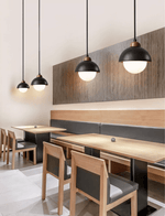 Zenith Pebble Pendant Light — Black Travertine & Opal Glass Designer Pendant