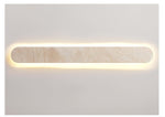 Lior Sculptural Travertine LED Wall Sconce for Modern Interiors