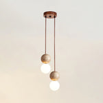 Camille Travertine Pendant Light – Natural Stone Sphere with Opal Glass Globe