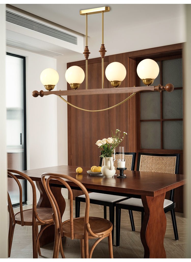 Adorned Linear Chandelier in Walnut and Brass with Glass Orbs