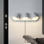 Lumina 360° Adjustable Plug-In LED Wall Sconce in Black or White