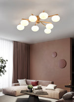 Astrora Globe Ceiling Light – Opal Glass & Brass Modern Chandelier