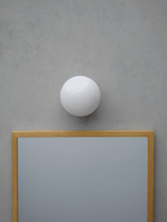 Aura Globe Glass Wall Sconce in Brass for Modern Interiors