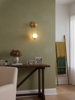 Aurea Brass Wall Sconce – Modern Minimalist Oval Glass Wall Light