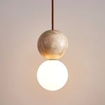 Camille Travertine Pendant Light – Natural Stone Sphere with Opal Glass Globe