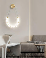bead-cascade-loop-wall-lamp