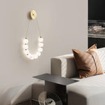 bead-cascade-loop-wall-lamp