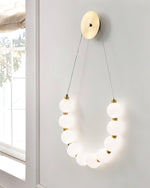 bead-cascade-loop-wall-lamp
