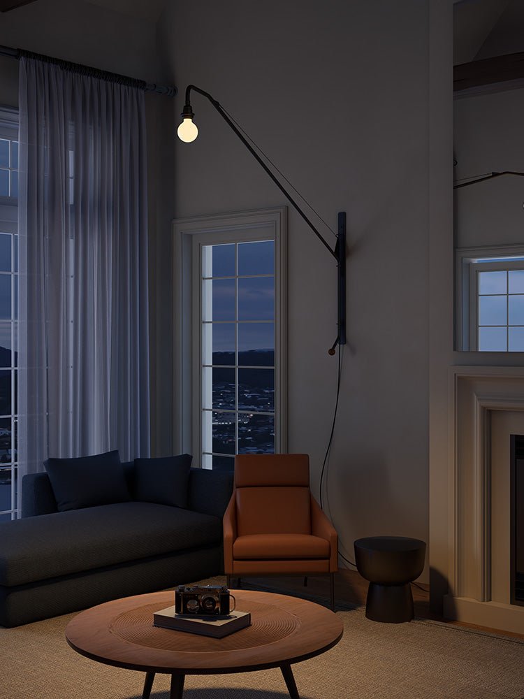 Modern Swing Arm Wall Sconce with Extended Reach in Matte Black