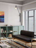 Modern Swing Arm Wall Sconce with Extended Reach in Matte Black