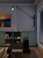 Modern Swing Arm Wall Sconce with Extended Reach in Matte Black