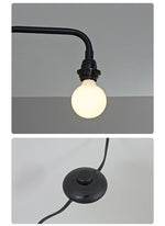 Modern Swing Arm Wall Sconce with Extended Reach in Matte Black
