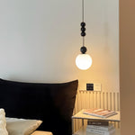 Bola Modern Pendant Light with Opal Glass Globe and Black Spheres