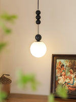 Bola Modern Pendant Light with Opal Glass Globe and Black Spheres