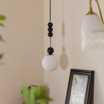 Bola Modern Pendant Light with Opal Glass Globe and Black Spheres
