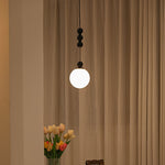 Bola Modern Pendant Light with Opal Glass Globe and Black Spheres