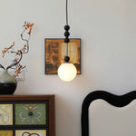 Bola Modern Pendant Light with Opal Glass Globe and Black Spheres