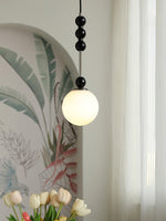 Bola Modern Pendant Light with Opal Glass Globe and Black Spheres