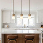 Camille Travertine Pendant Light – Natural Stone Sphere with Opal Glass Globe