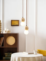 Camille Travertine Pendant Light – Natural Stone Sphere with Opal Glass Globe