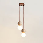 Camille Travertine Pendant Light – Natural Stone Sphere with Opal Glass Globe