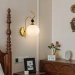 Celeste Curved Wall Sconce in Gold or Black with Pleated Glass Shade