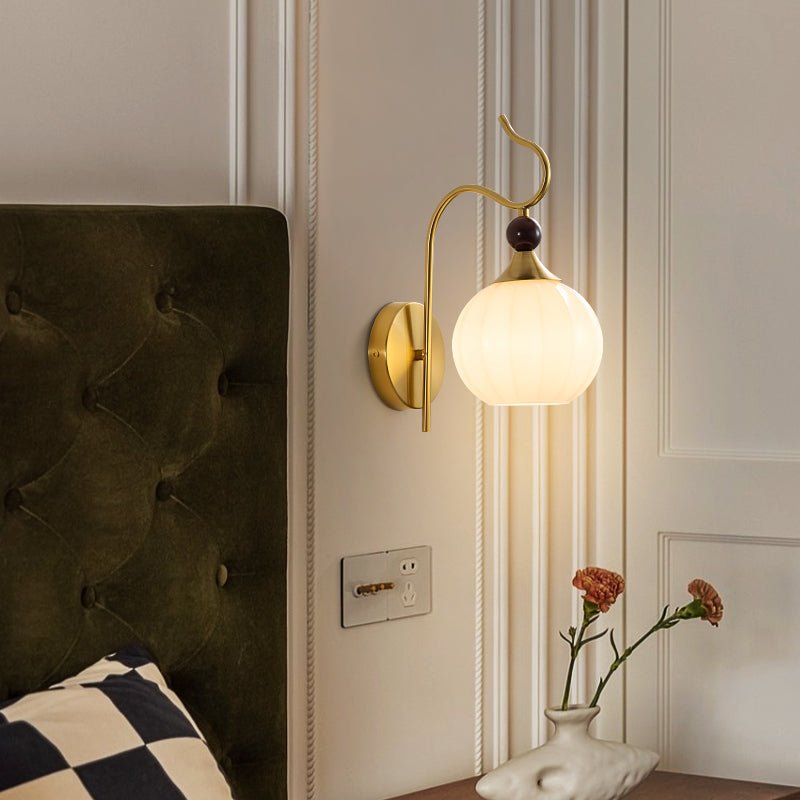 Celeste Curved Wall Sconce in Gold or Black with Pleated Glass Shade