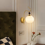 Celeste Curved Wall Sconce in Gold or Black with Pleated Glass Shade