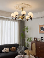 Ceylian Modern Wood and Glass Chandelier with Brass Accents for Dining Room and Foyer