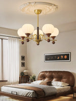 Ceylian Modern Wood and Glass Chandelier with Brass Accents for Dining Room and Foyer