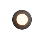 Crater Backlit Wall Sconce in Black Travertine with Opal Glass Globe