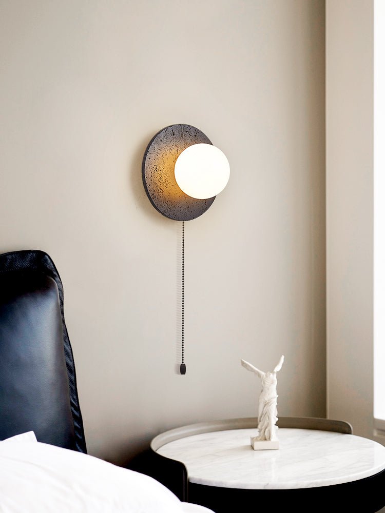 Crater Backlit Wall Sconce in Black Travertine with Opal Glass Globe