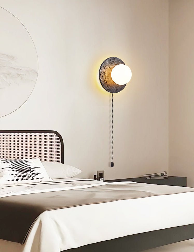 Crater Backlit Wall Sconce in Black Travertine with Opal Glass Globe