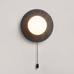 Crater Backlit Wall Sconce in Black Travertine with Opal Glass Globe