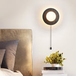 Crater Backlit Wall Sconce in Black Travertine with Opal Glass Globe
