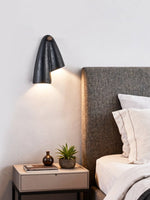 Creska Sculptural Wall Sconce in Black Travertine and Walnut