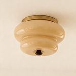 Curvaceous Flush Mount Ceiling Light with Gold Accents and Glass Shade
