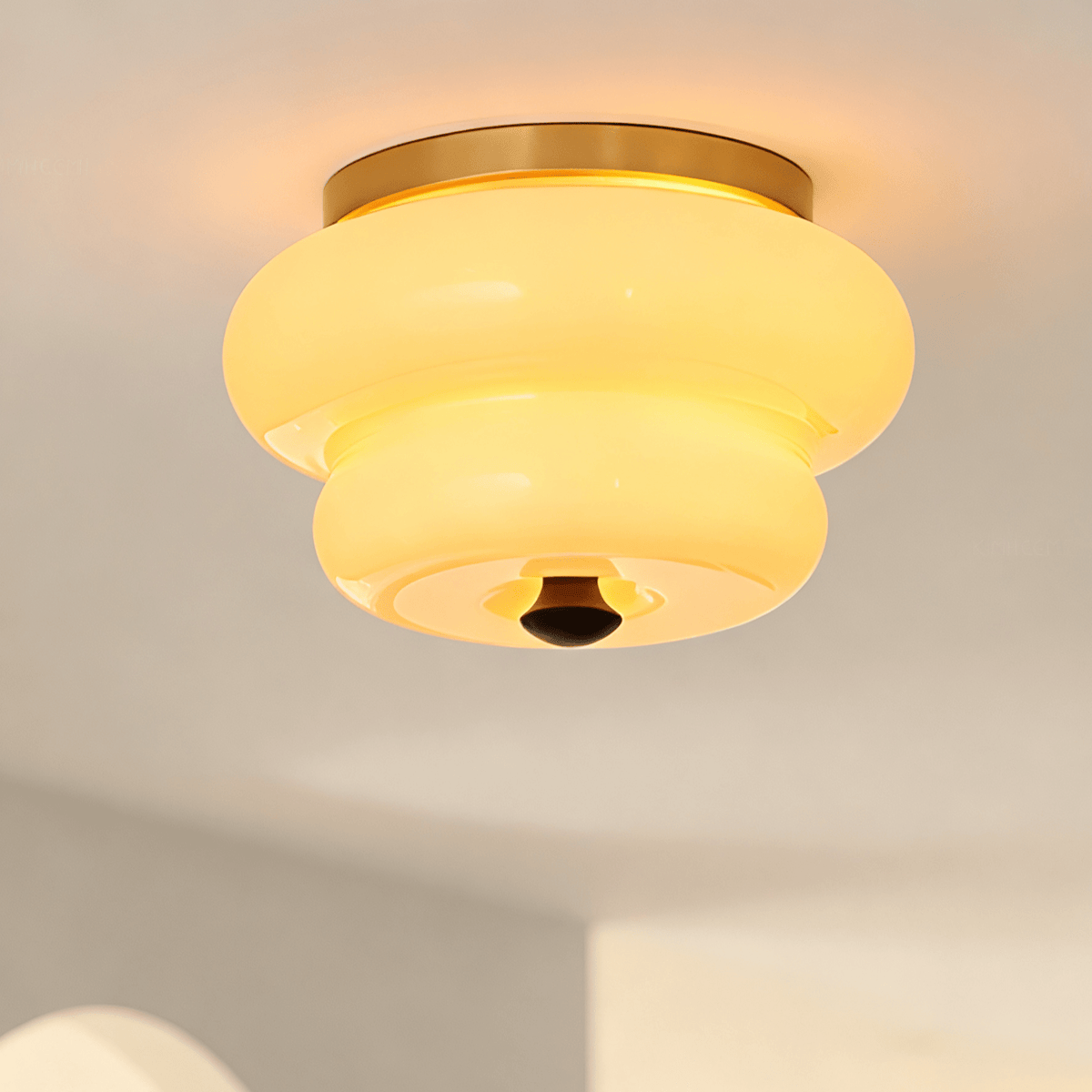 Curvaceous Flush Mount Ceiling Light with Gold Accents and Glass Shade