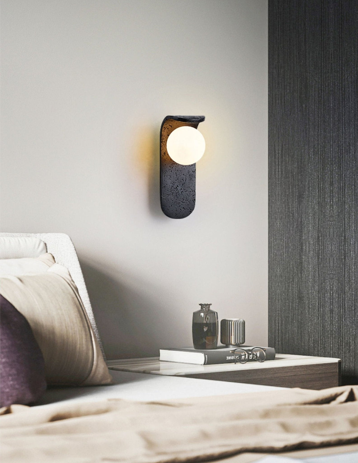 Eclipse Orb Wall Sconce in Black Travertine with Opal Glass Shade