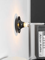 Eclipta Wall Sconce – Sculptural Metal & Glass Halo Light for Modern Interiors