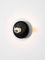 Eclipta Wall Sconce – Sculptural Metal & Glass Halo Light for Modern Interiors