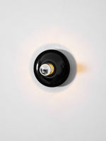 Eclipta Wall Sconce – Sculptural Metal & Glass Halo Light for Modern Interiors