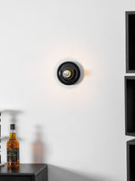 Eclipta Wall Sconce – Sculptural Metal & Glass Halo Light for Modern Interiors