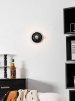 Eclipta Wall Sconce – Sculptural Metal & Glass Halo Light for Modern Interiors