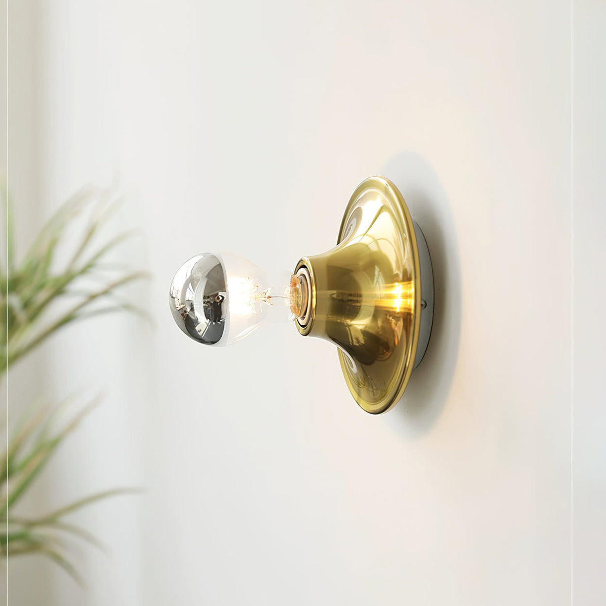 Eclipta Wall Sconce – Sculptural Metal & Glass Halo Light for Modern Interiors