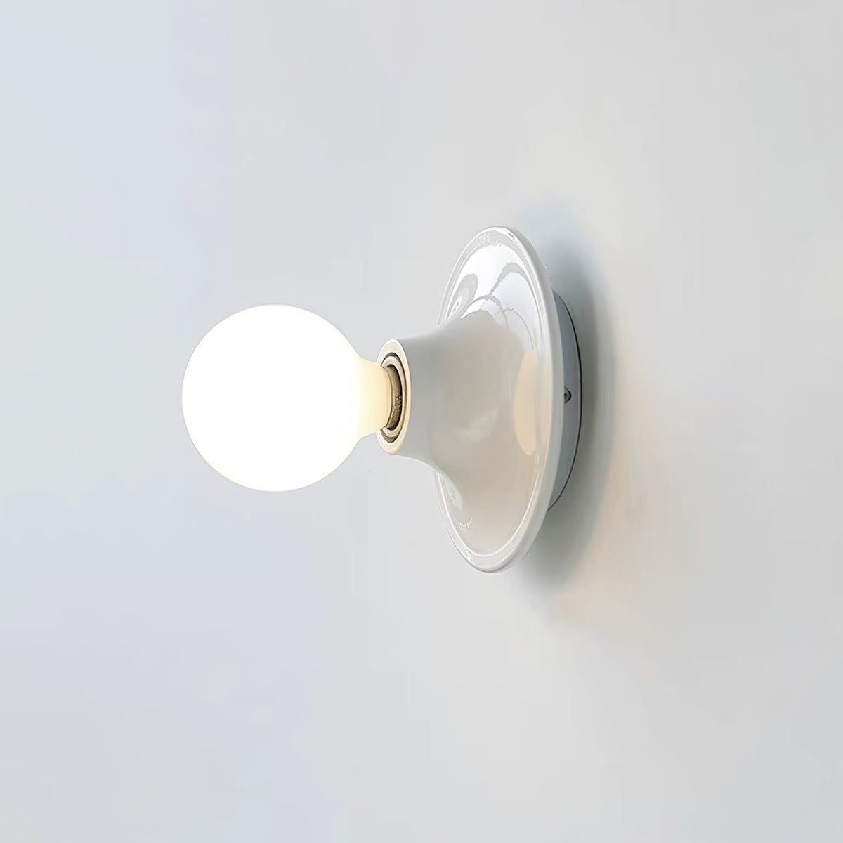 Eclipta Wall Sconce – Sculptural Metal & Glass Halo Light for Modern Interiors