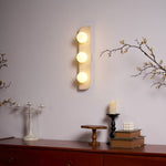 Elysian Travertine Plug-in Wall Sconce with Glass Globes