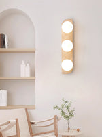 Elysian Travertine Wall Sconce with Glass Globes – Modern Natural Stone Lighting